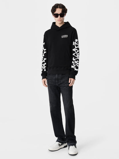 SIGNATURE BONES DETAILING AND CORE AMIRI LOGO.