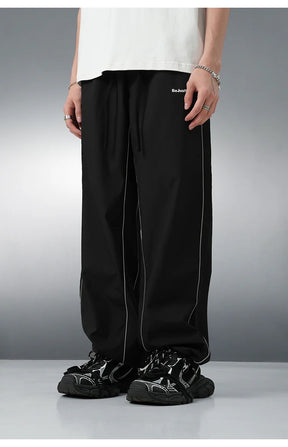 REFLECTIVE STRIPED TRACK PANTS