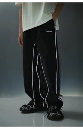 REFLECTIVE STRIPED TRACK PANTS