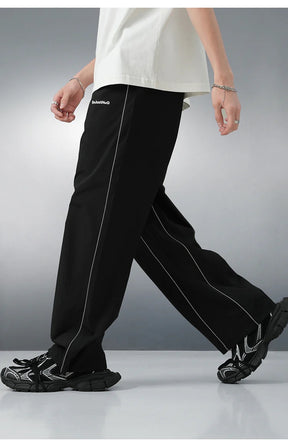 REFLECTIVE STRIPED TRACK PANTS