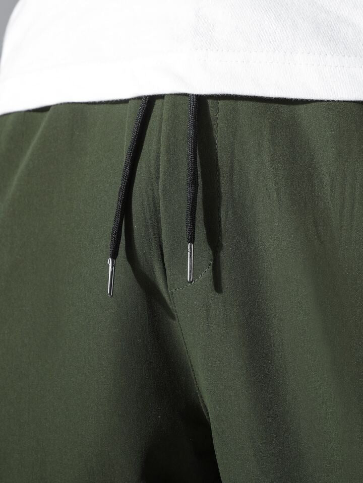 Men Drawstring Waist Slant Pocket Pants