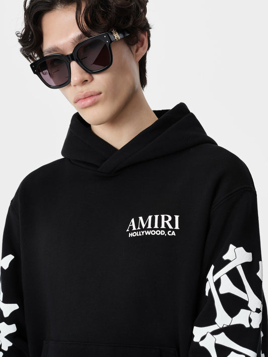 SIGNATURE BONES DETAILING AND CORE AMIRI LOGO.